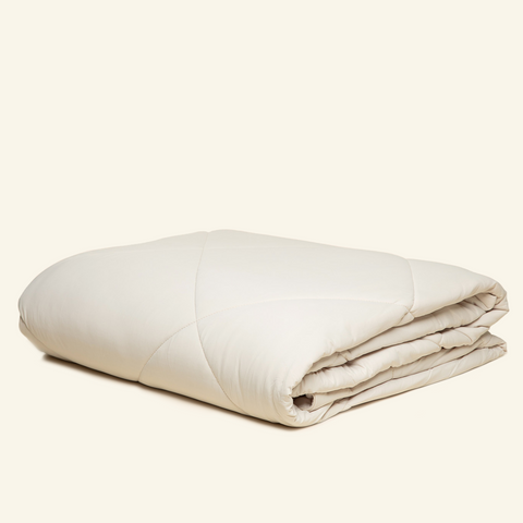 The Lightweight UltraCool Comforter folded in the Sand color