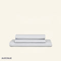 A neatly folded set of Slumber Cloud Performance Sheets in alice on a cream background