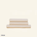 A neatly folded set of Slumber Cloud Performance Sheets in cream on a cream background