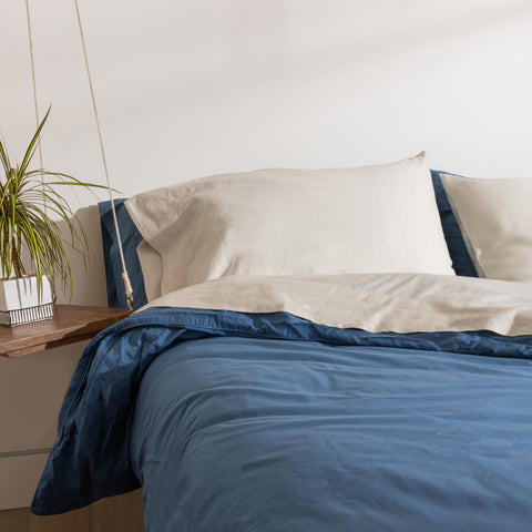 A neatly made bed with Slumber Cloud products.